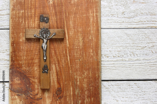 Wooden cross on wooden background © Pawel Spychala