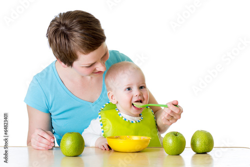 mother feeding her baby boy