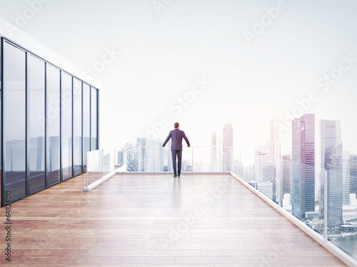 businessman looking at city