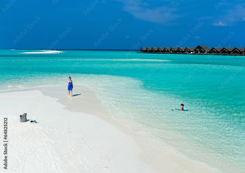 Mother and son at tropical beach