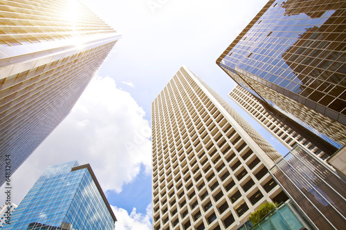 Low angle shot of modern glass city buildings