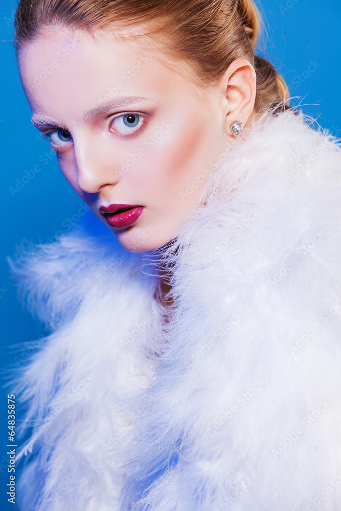 beautiful woman in white cape of feathers. Fashion photo beautiful woman in white cape of feathers. Fashion photo