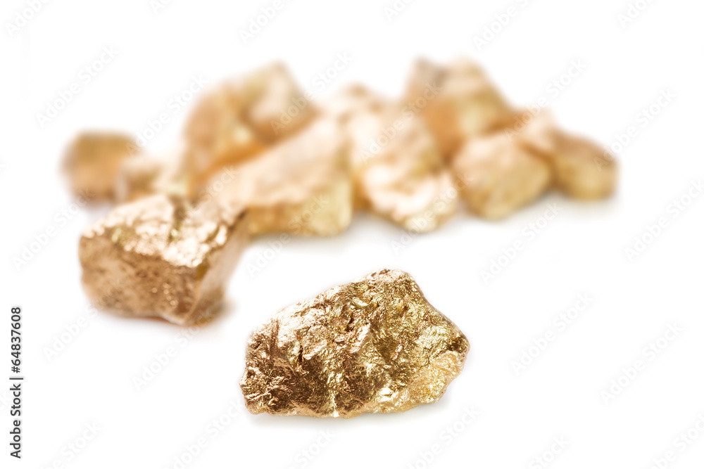 Gold nuggets on white background.