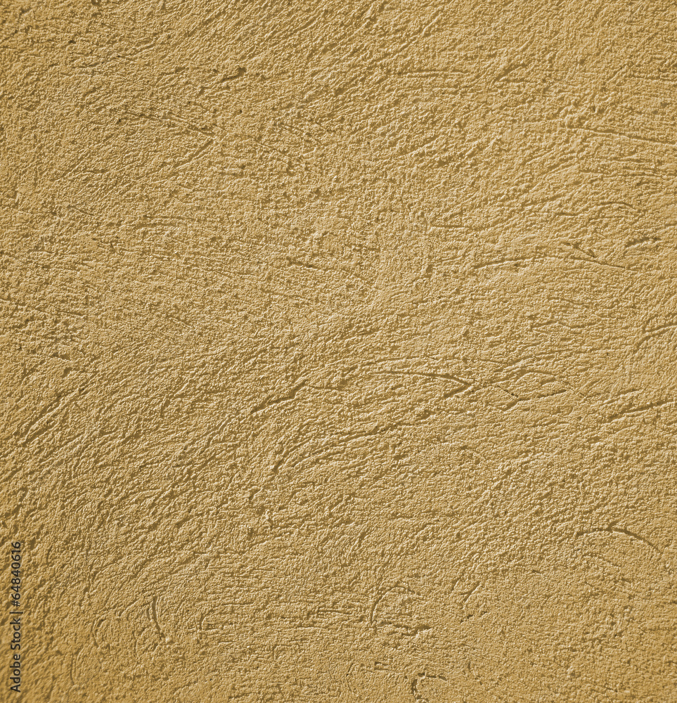 beige colored house front, structured with spatula techniques, b