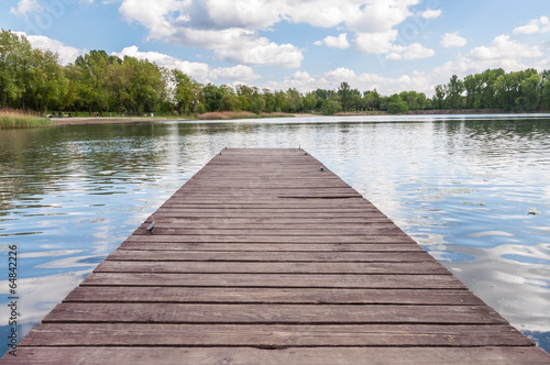 Old wooden jetty at a lake