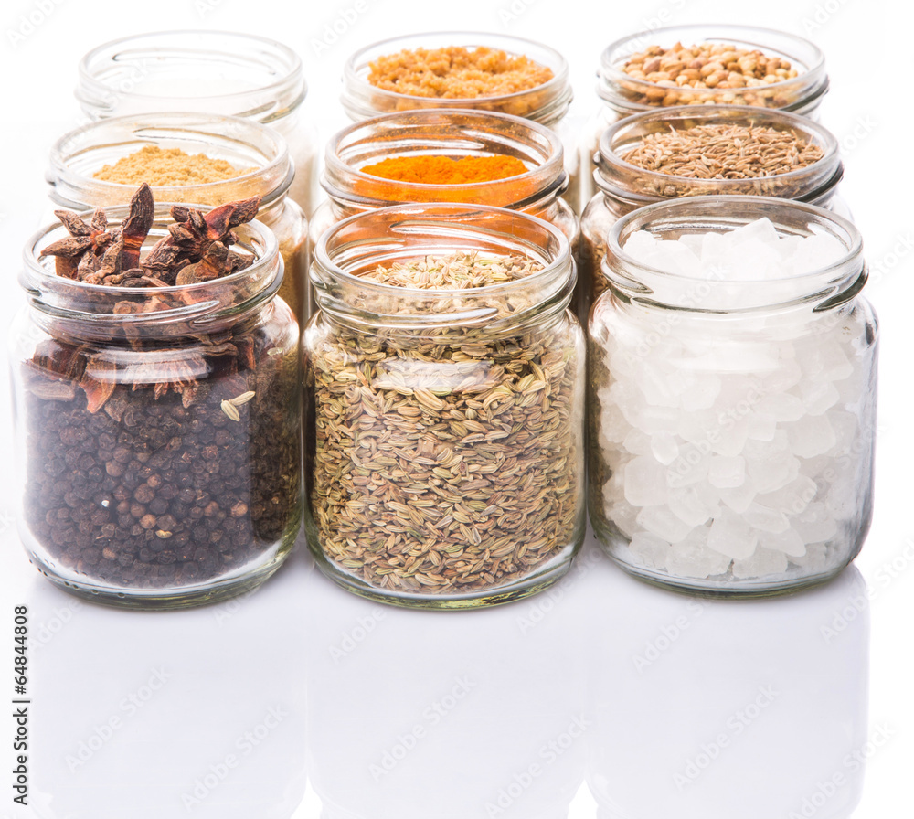 Different variety of sugar and spices over white background Different variety of sugar and spices over white background