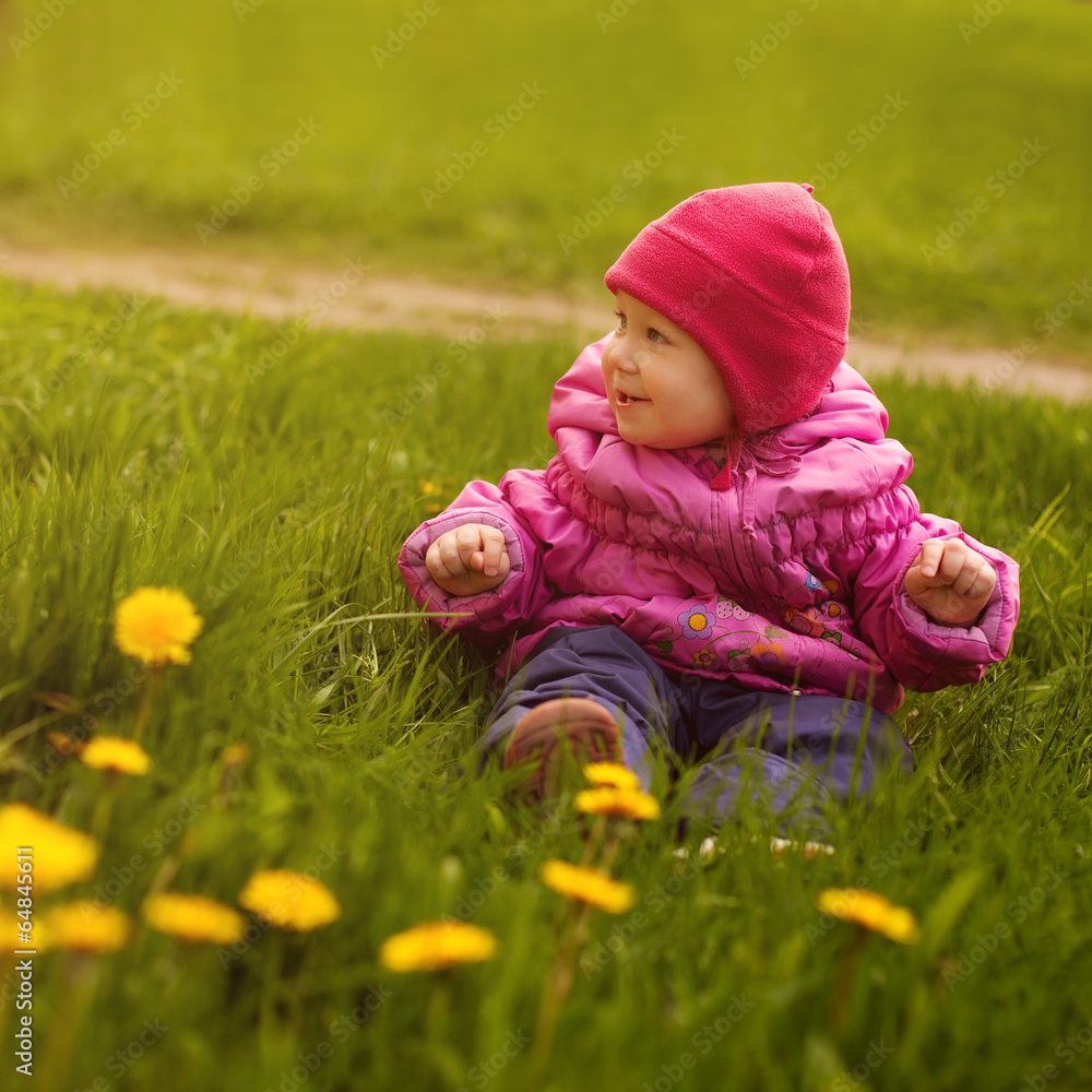Little girl on a green meadow Little girl on a green meadow