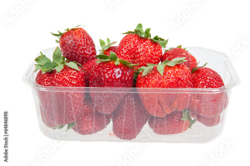 Tableau sur toile Fresh strawberries in plastic box, isolated on white