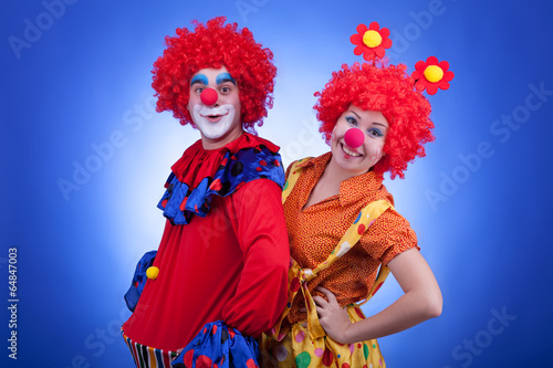 Clowns on blue background studio shooting