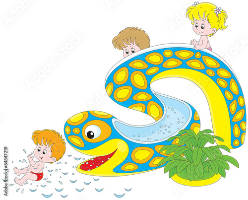 Little girl and boys sliding down from a waterslide