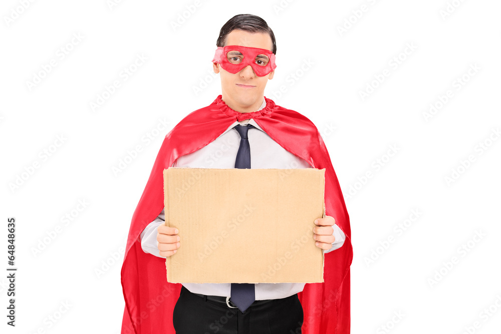 Male superhero holding blank carton sign Male superhero holding blank carton sign