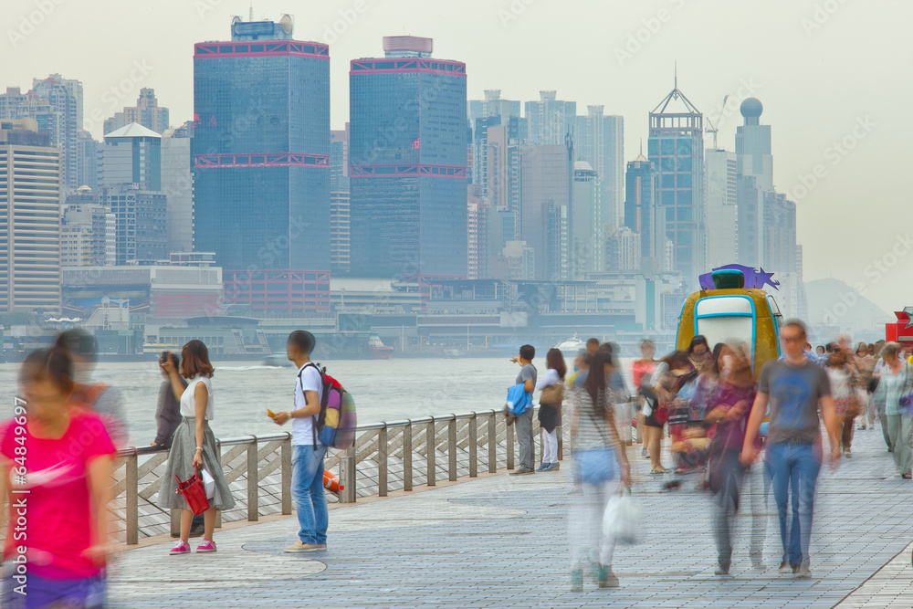 Fototapeta premium People blurred in motion on the street walking