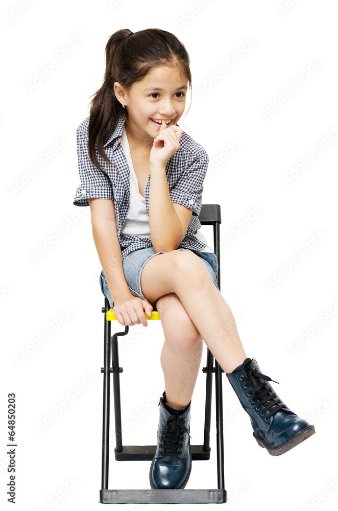 Little girl sitting on chair portrait on white background Stock Photo ...