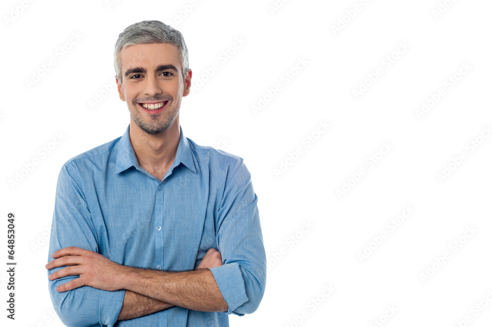 Casual smiling man with arms crossed Casual smiling man with arms crossed