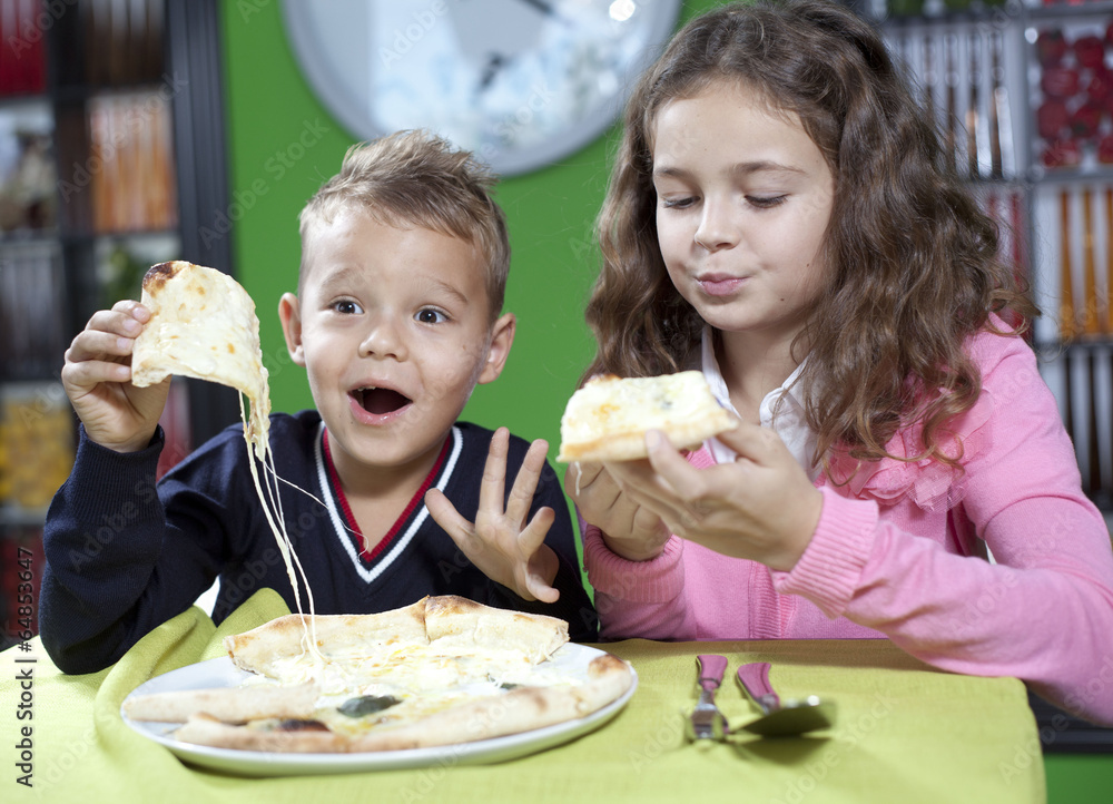 happy little girl and boy eat pizza happy little girl and boy eat pizza