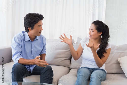 Couple having a dispute on the sofa