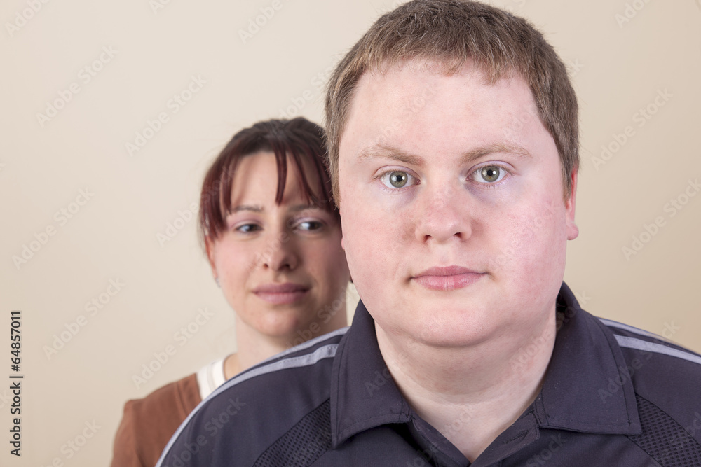 Woman with worried look behind man Woman with worried look behind man