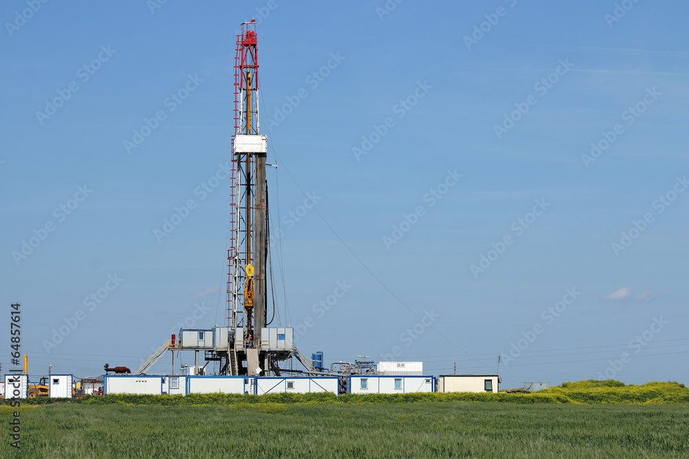 land oil drilling rig on green field landscape land oil drilling rig on green field landscape