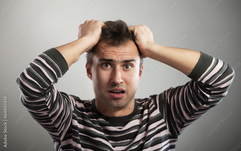 Portrait of a frustrated man looking at camera Portrait of a frustrated man looking at camera