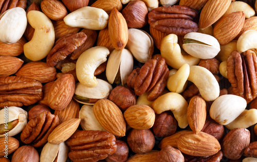 Background texture of assorted mixed nuts including cashew nuts,