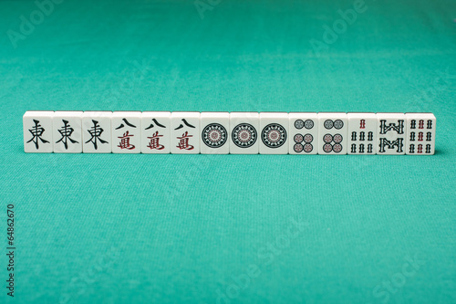 Smooth table surface with a mahjong on it