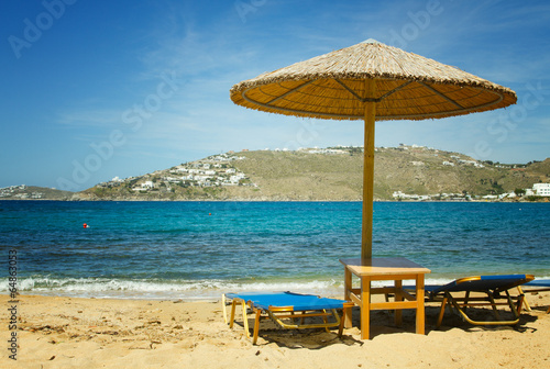 Sunbeds and umbrellas on Mykonos beach