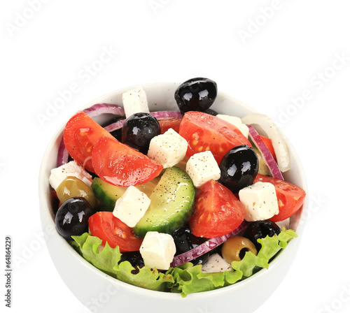 Fresh greek salad in clay bowl.
