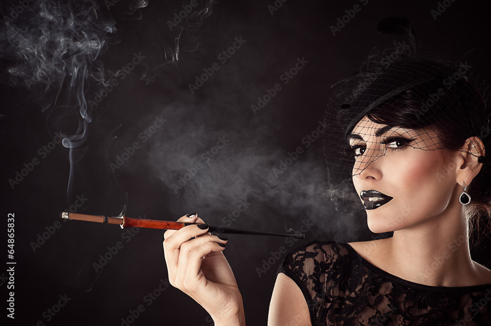 Fototapeta premium attractive woman with dark makeup with mouthpiece