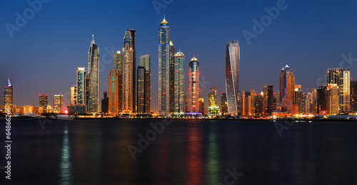 Dubai Marina at dusk as viewed from Palm Jumeirah in Dubai, UAE