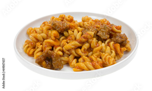 Plate of pasta with sausage in tomato sauce