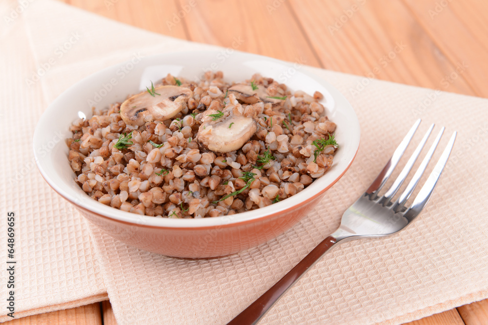 Boiled buckwheat in bowl on table close-up Boiled buckwheat in bowl on table close-up
