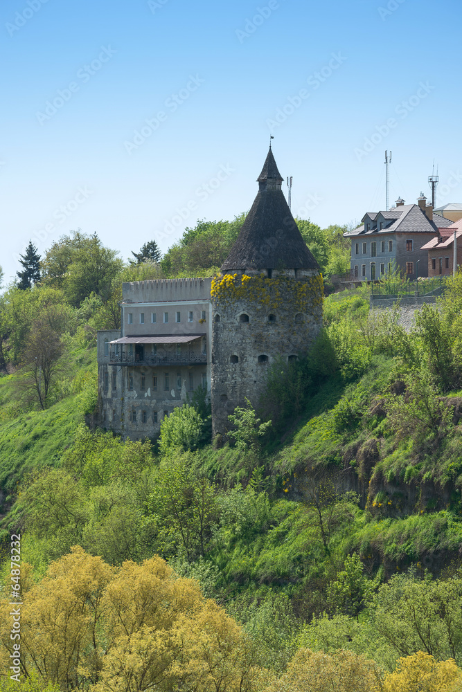Obraz premium Tower on the rocky shore.