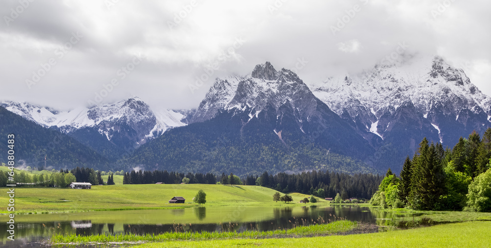 Mountain tops and green fields in German Alps Mountain tops and green fields in German Alps