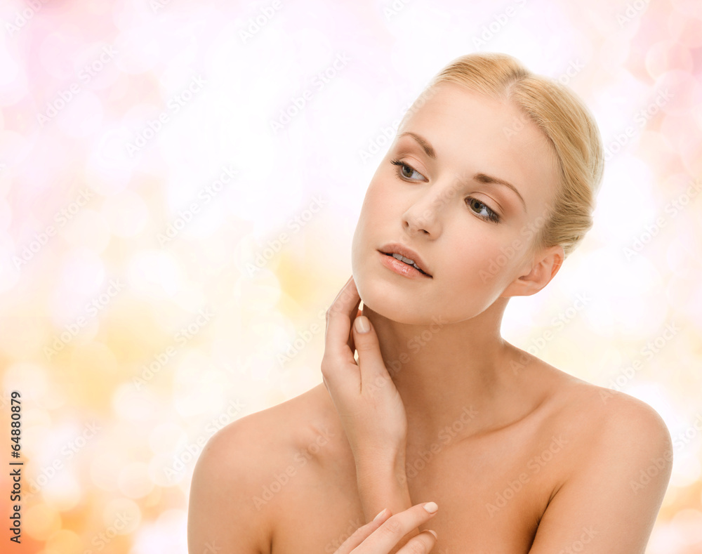 Naklejka premium beautiful woman touching her face skin