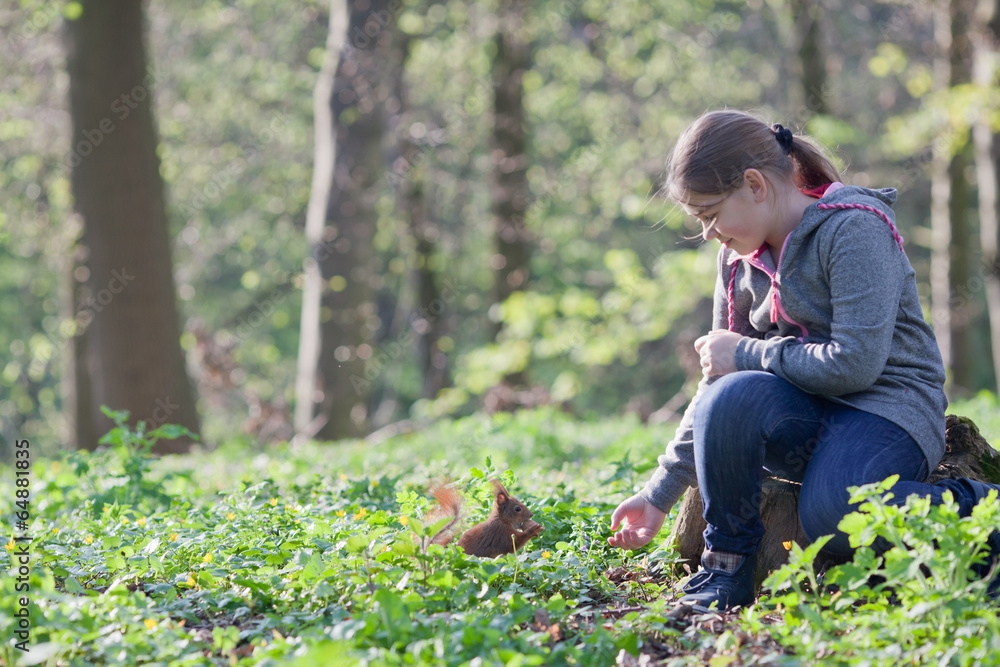 Little girl and squirrel