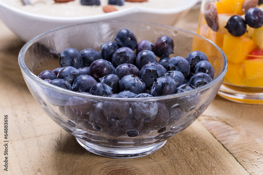 Fresh fruity dessert with bowl of porridge Fresh fruity dessert with bowl of porridge