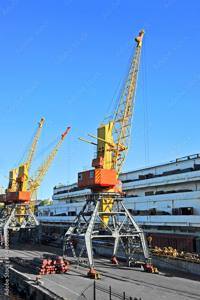 Pipe stack, ready for shipping under cargo crane Pipe stack, ready for shipping under cargo crane