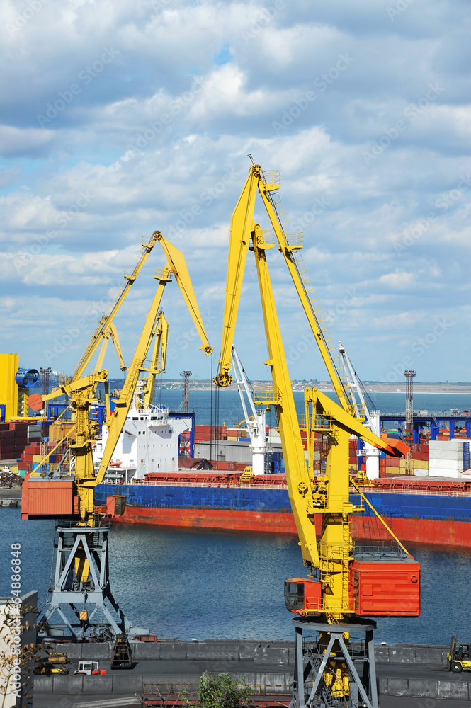 Bulk cargo ship under port crane bridge, Odessa, Ukraine