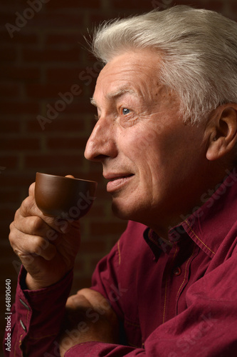 Man with cap of coffee