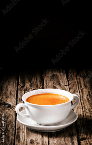 Bowl of delicious homemade carrot soup photo
