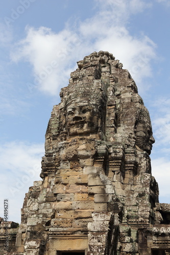 stone face of bayon temple in angkor thom cambodia