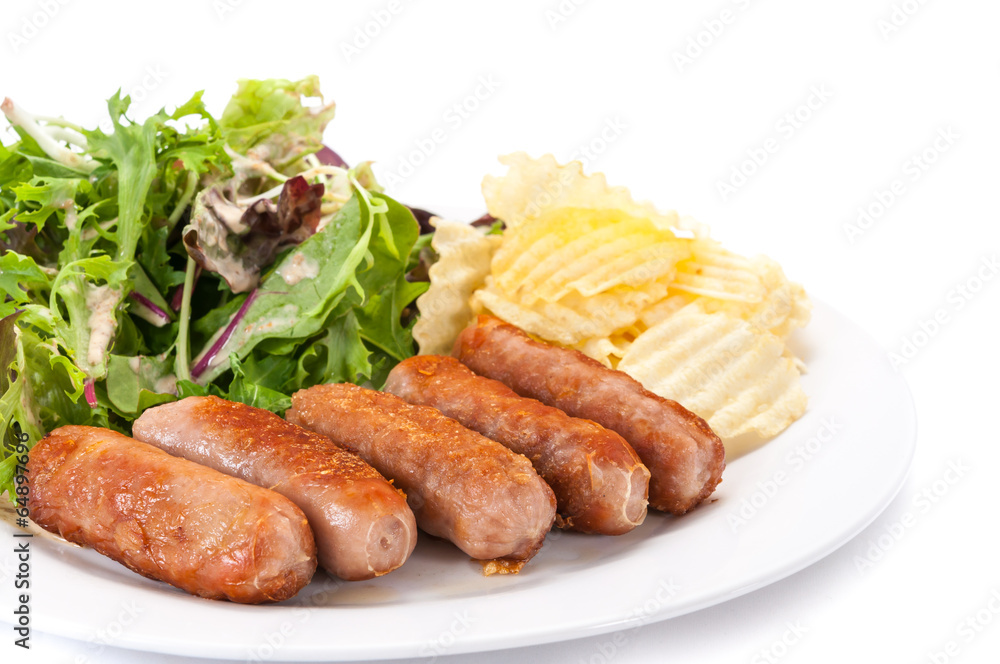 Grilled sausages vegetables and chips Grilled sausages vegetables and chips