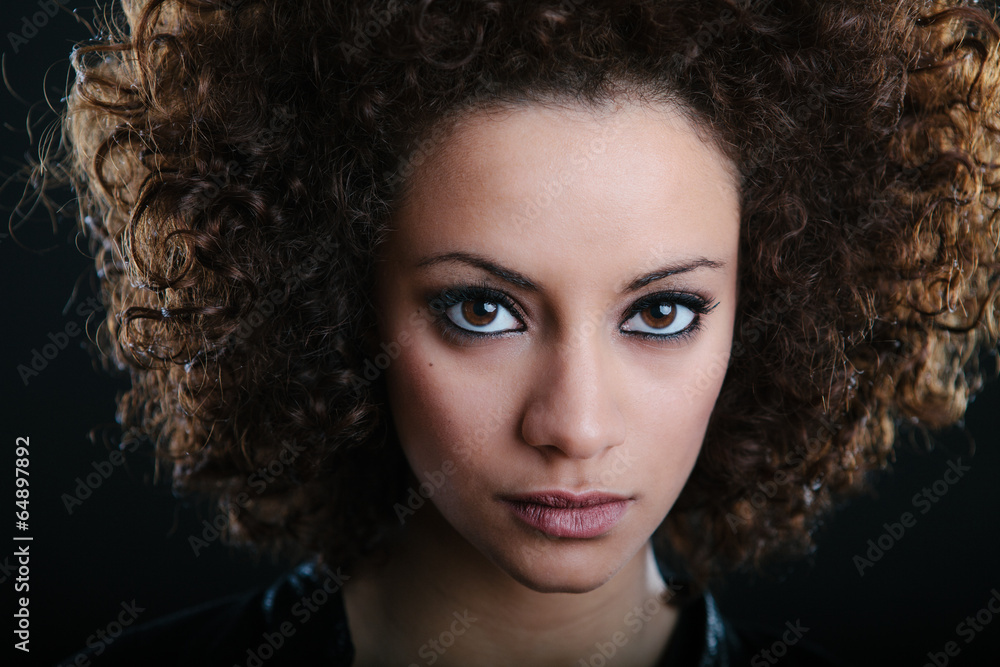 A beautiul arabian model posing at a studio.