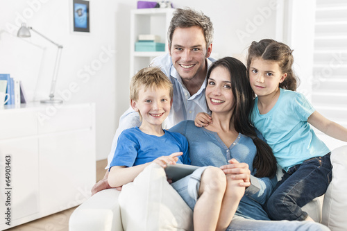 family playing together on a digital tablet