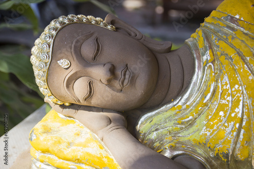 Fototapeta reclining gold buddha statue