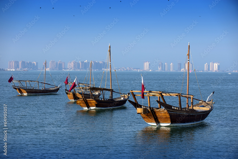 Boats on a background of a modern city in doha
