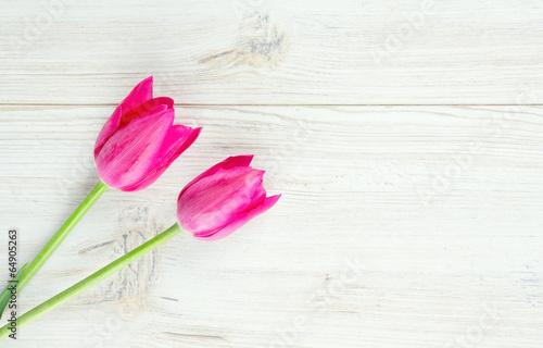 Fototapeta Naklejka Na Ścianę i Meble -  pink tulips on wooden surface