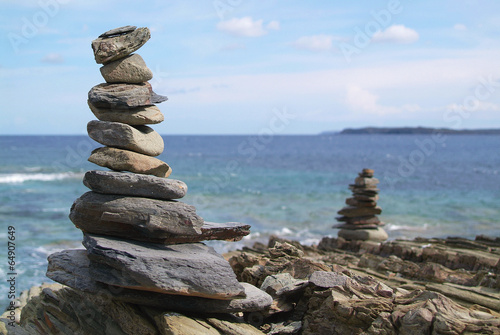 Stack of stones on beach, sea and sky