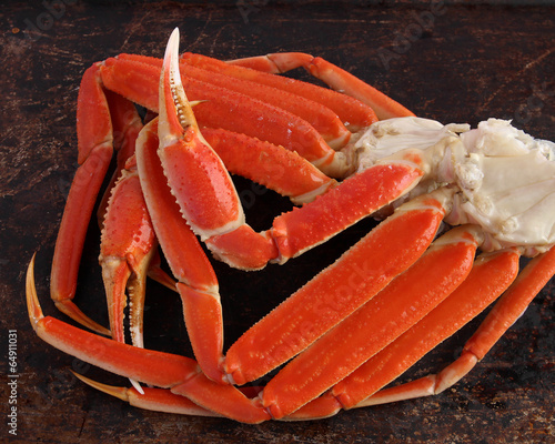 Crab legs on brown background