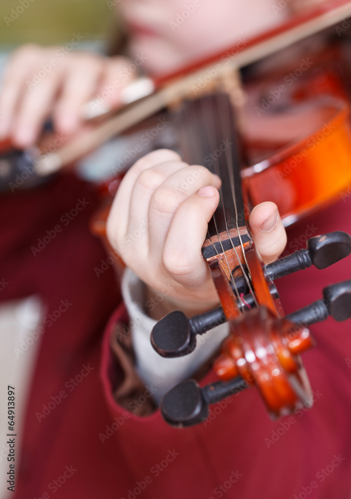 girl plays on violin - chord on fingerboard girl plays on violin - chord on fingerboard